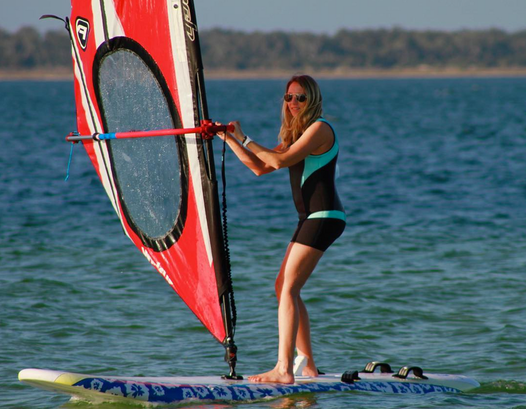 Truli Girl Lindy Brown windsurfing in her Truli Wetsuits for women