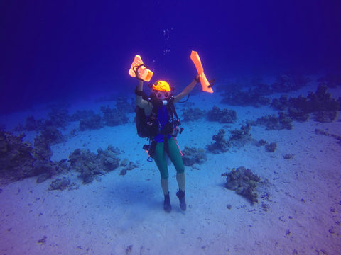 Ulli Herold from Ullis Diving in Egypt dancing underwater in her Truli Wetsuits